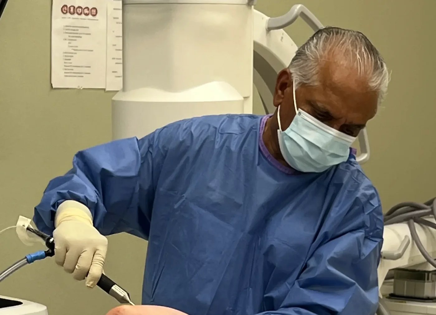 Dr. Butchaiah Garlapati performing a procedure